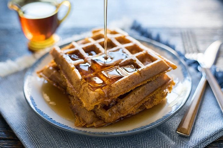 Pouring Syrup on Pumpkin Waffles